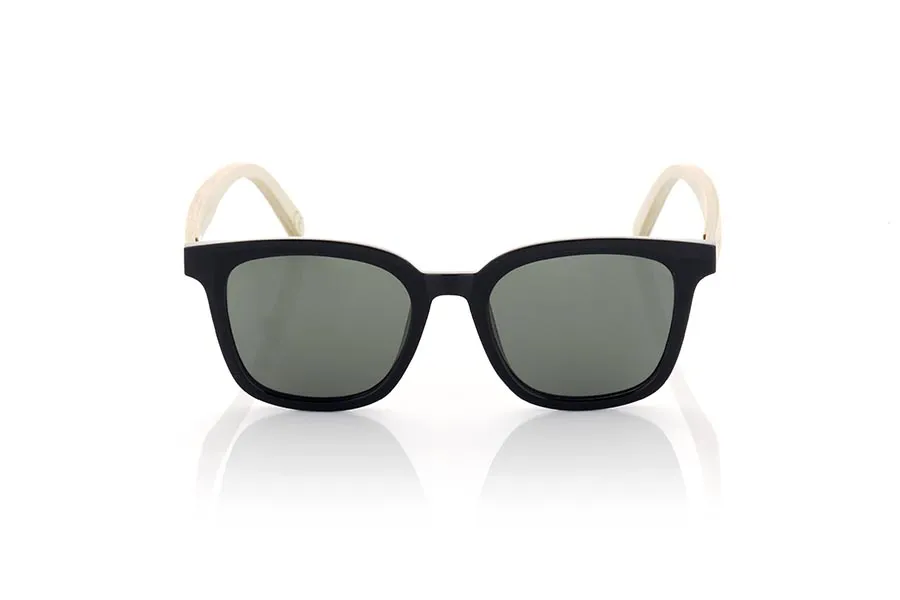 Wood eyewear of Maple MALM. MALM sunglasses are an ideal option for those looking for a modern and daring design with a touch of originality. Its completely straight and flat frame in satin black gives it a modern and elegant look. With rounded shapes and a marked brow, these glasses are suitable for both men and women. The very light maple wood temples add an interesting contrast and a natural touch to the design. In addition, these glasses are available with clear flat lenses in various colors, such as yellow, blue, pink and khaki green, allowing you to customize your look and adapt it to your personal style. Without a doubt, MALM sunglasses are a perfect choice for those looking for a combination of modern design and marked style. for Wholesale & Retail | Root Sunglasses® 